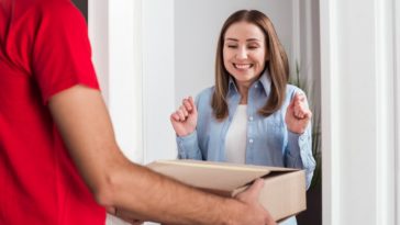 excited woman receiving a package delivery