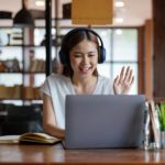 woman with headphones on a video call