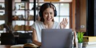 woman with headphones on a video call