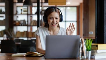 woman with headphones on a video call