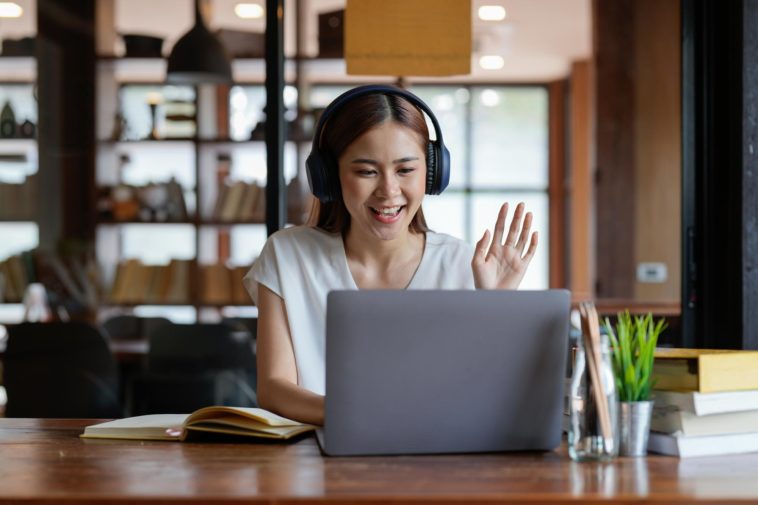 woman with headphones on a video call