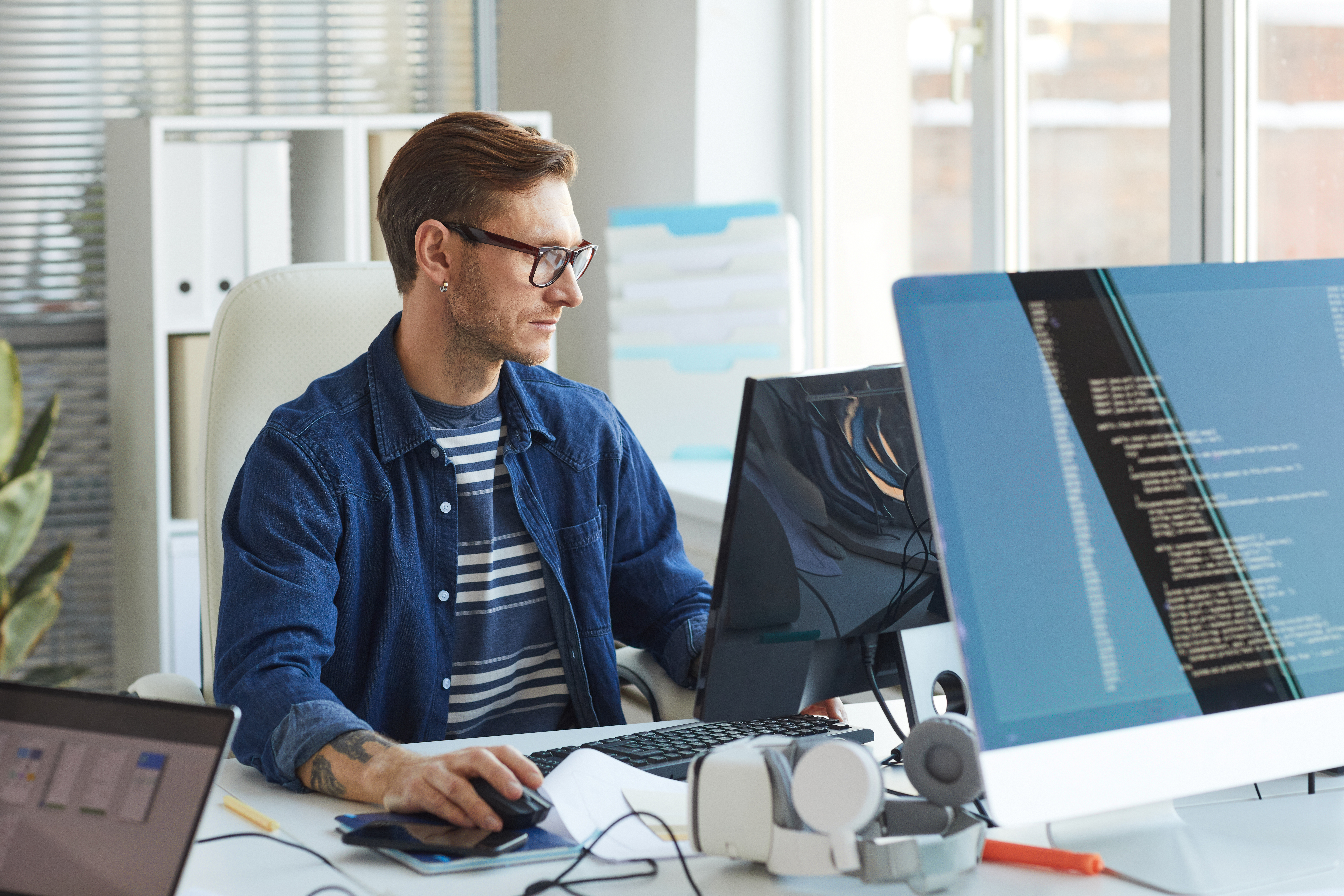 man working on a computer in IT