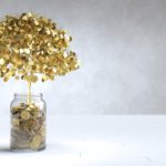 tree made of gold coins growing out of a jar of coins