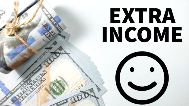 dollar bills next to an extra income and smiley face drawing in black