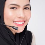 smiling woman wearing a headset