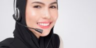 smiling woman wearing a headset