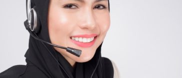 smiling woman wearing a headset