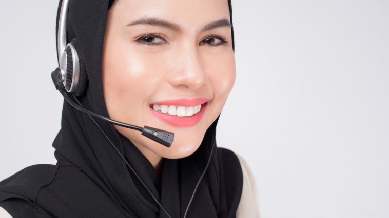 smiling woman wearing a headset