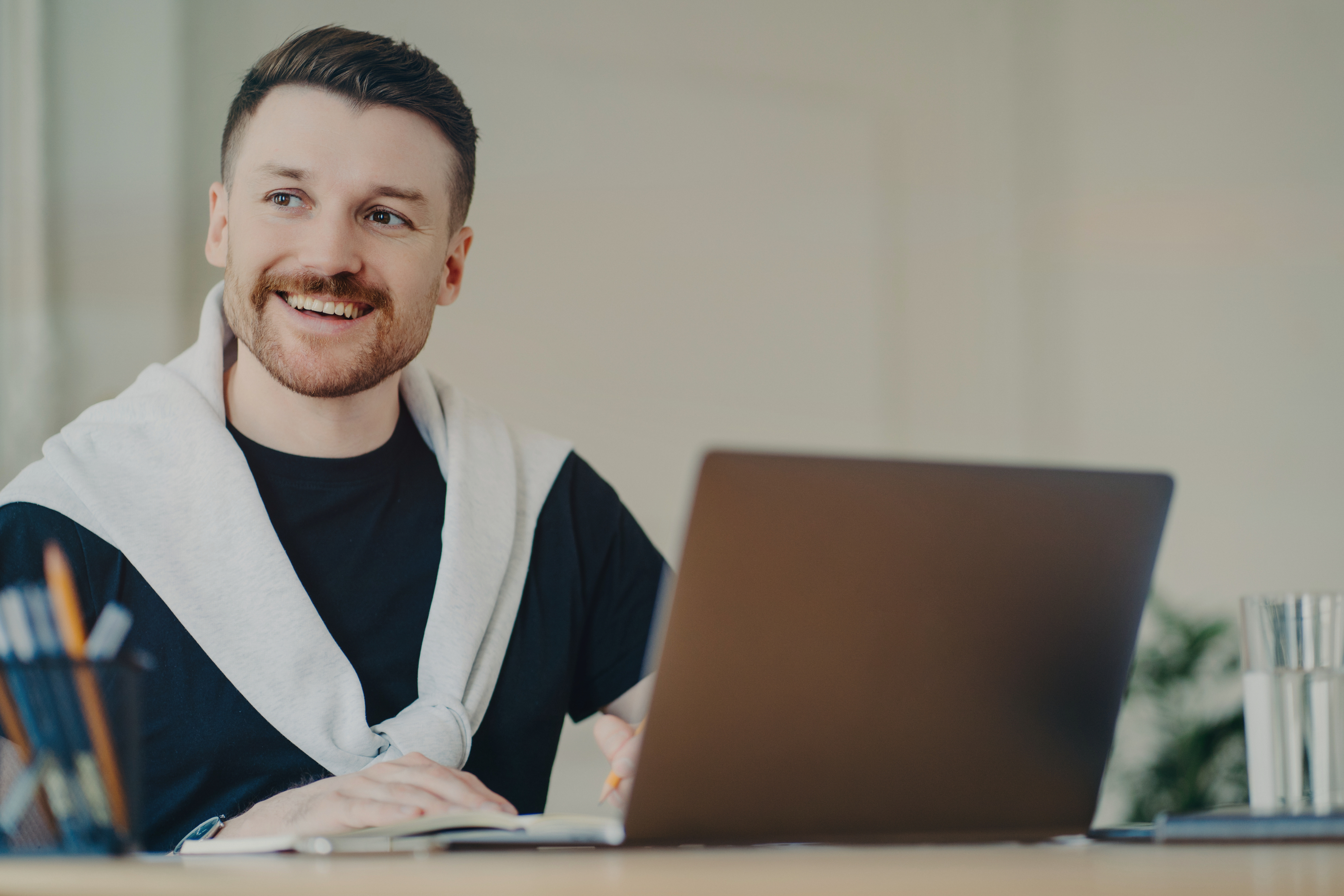 happy man working on a laptop