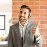 smiling man with a headset