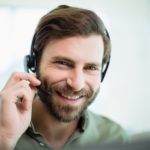 smiling man with a headset