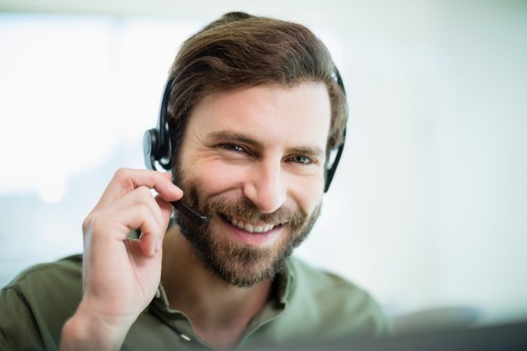 smiling man with a headset