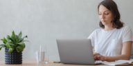 woman in a home office working on a laptop