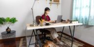 woman working at a desk on a laptop at home