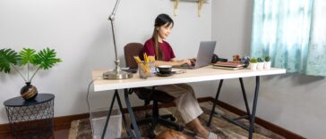 woman working at a desk on a laptop at home