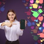 woman pointing at a smartphone with colorful social media icons around her