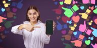 woman pointing at a smartphone with colorful social media icons around her