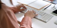 close-up of women hands typing on a keyboard