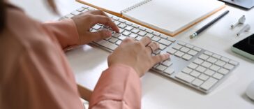 close-up of women hands typing on a keyboard