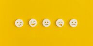 emoticon smiley faces on a yellow background