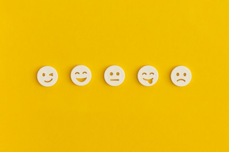 emoticon smiley faces on a yellow background