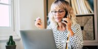 woman working from home talking on a phone