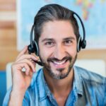 smiling man wearing a headset