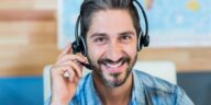 smiling man wearing a headset