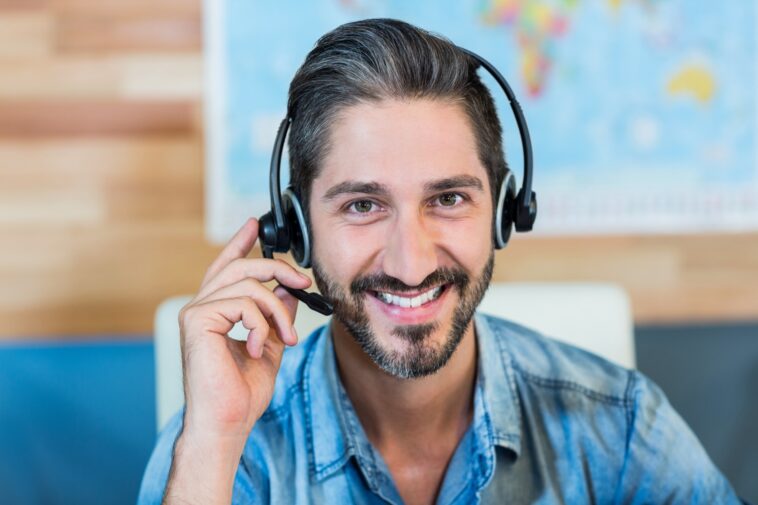 smiling man wearing a headset
