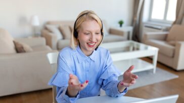 woman talking with headset at home