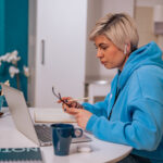 woman working on a laptop from home