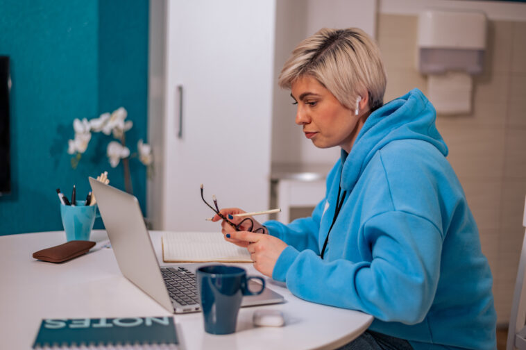 woman working on a laptop from home