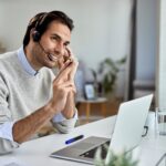 man talking with a headset at home