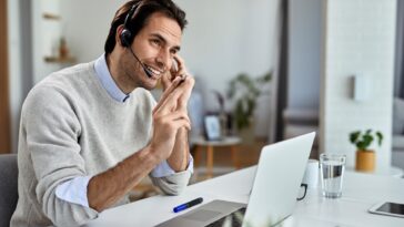 man talking with a headset at home