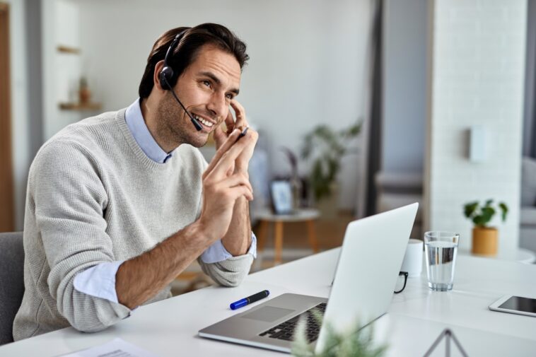 man talking with a headset at home