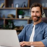 man wearing a headset working from home