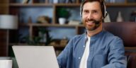 man wearing a headset working from home