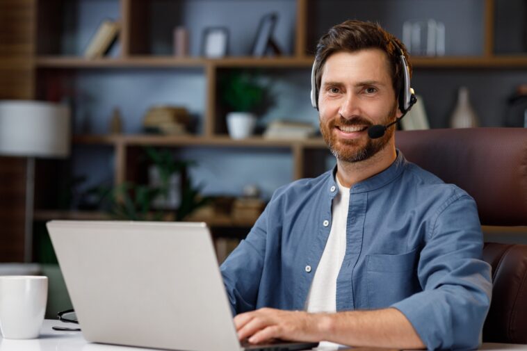 man wearing a headset working from home