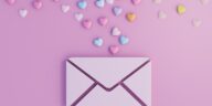 digital envelope with colorful 3d hearts on a pink background