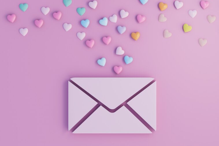 digital envelope with colorful 3d hearts on a pink background