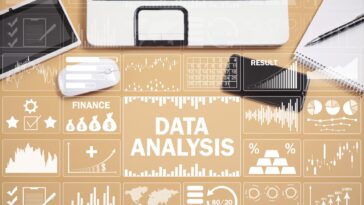 data analysis icons on a work desk