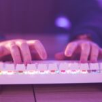 hands typing on a gaming keyboard