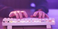 hands typing on a gaming keyboard