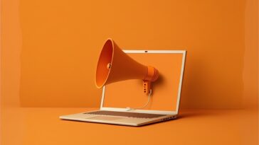 orange megaphone coming out of a laptop screen