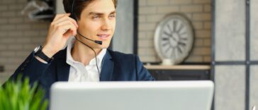 man with headset working remotely