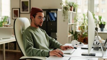 man working on a computer from home