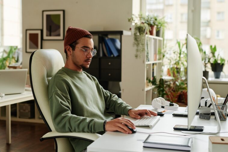 man working on a computer from home