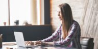 woman typing on a laptop