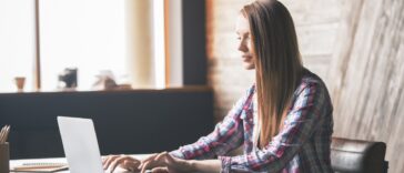 woman typing on a laptop